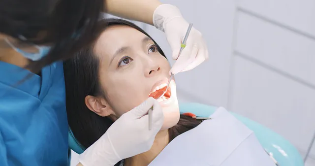 Dental patient having her teeth checked